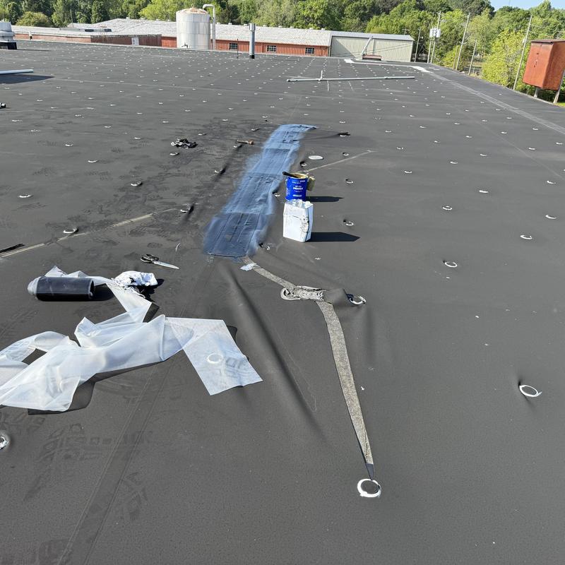 EPDM roof leak patch with GACO coating near AC unit