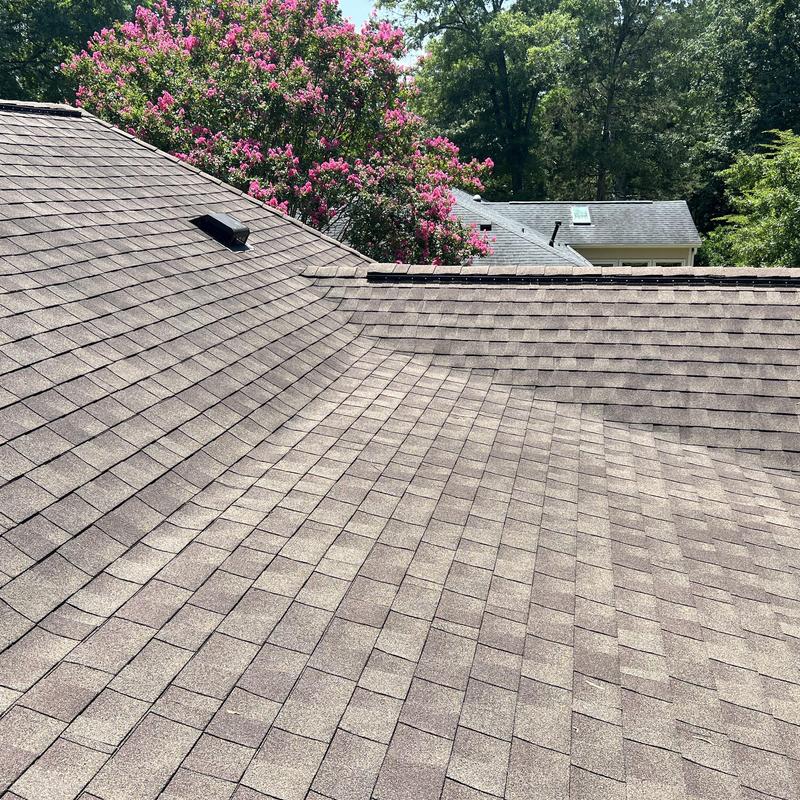 Low-slope asphalt shingle roof with pipe vent flashing