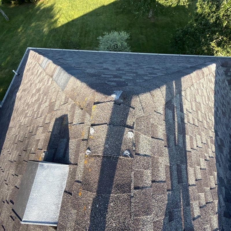 Roof shingles with hail damage and flashing issues