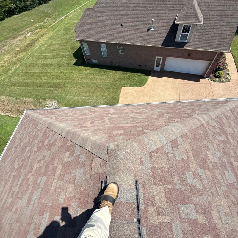 Asphalt shingle roof inspection showing hail damage
