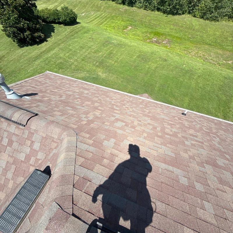 Asphalt shingle roof with visible inspection shadow