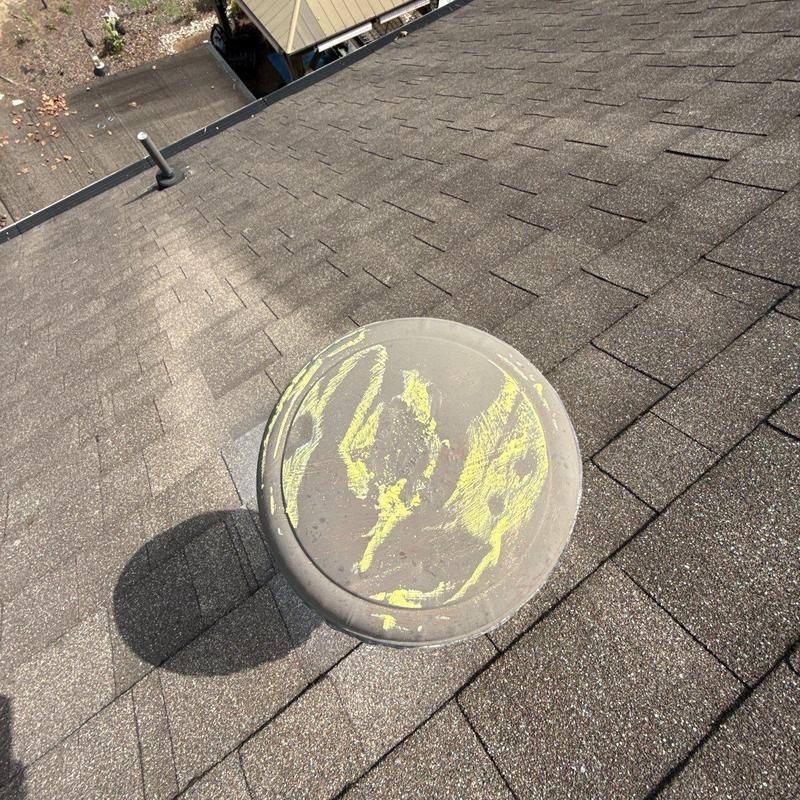 Roof vent with hail damage marked for repair