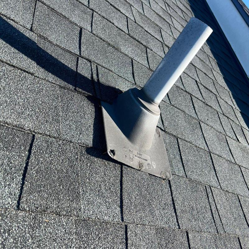 Roof vent flashing on asphalt shingle roof