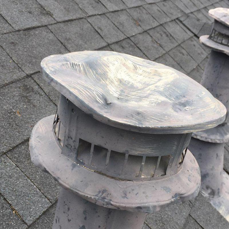Roof exhaust vent with hail damage on shingle roof Roof exhaust vent with hail damage on shingle roof