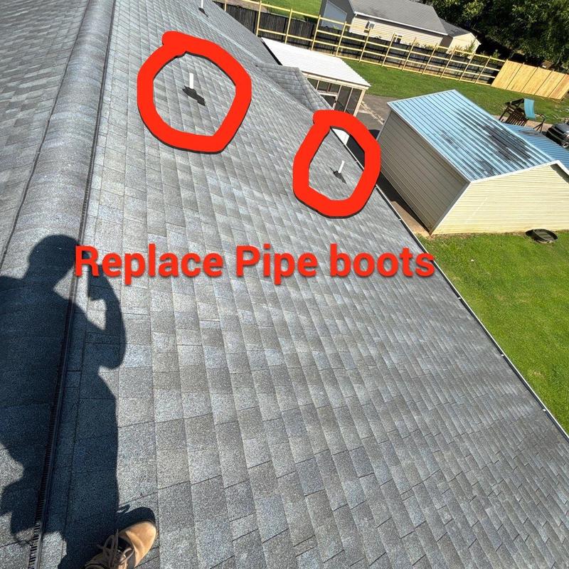Pipe boots on shingle roof marked for replacement