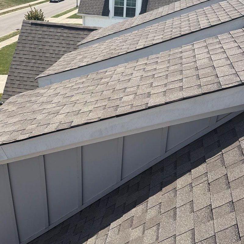 Asphalt shingle roof with hail damage inspection