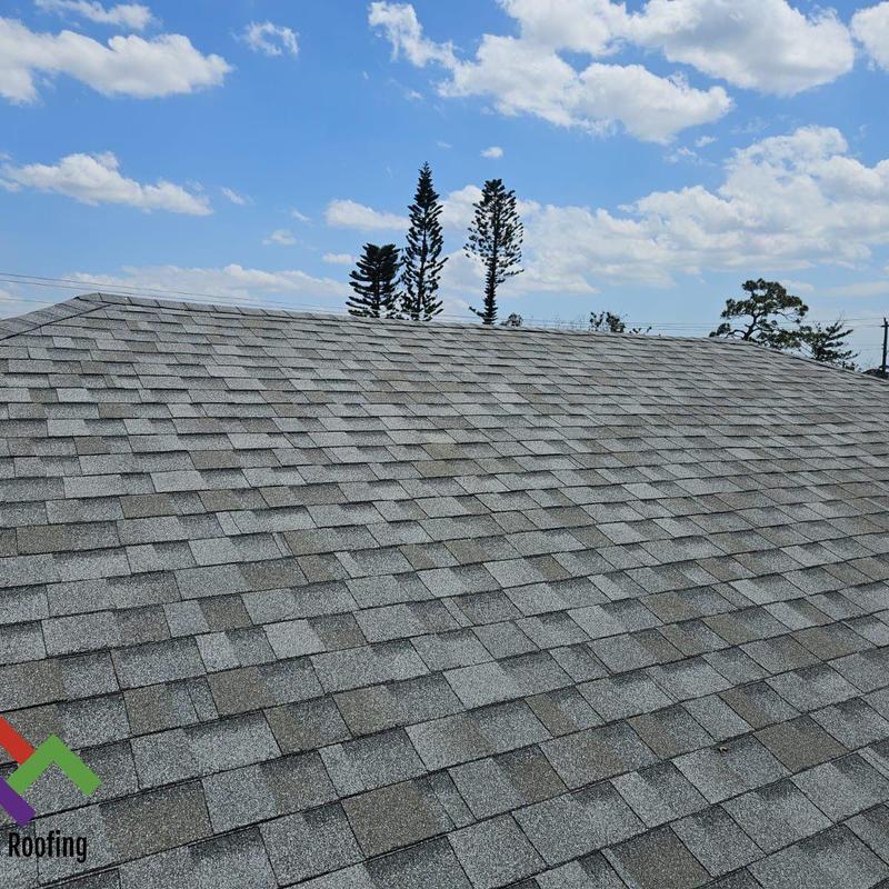 Asphalt shingle roof with full inspection under blue sky