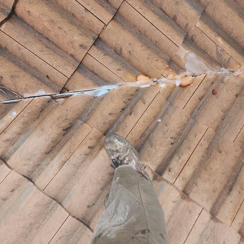 Clay tile roof with incorrect silicone leak repair
