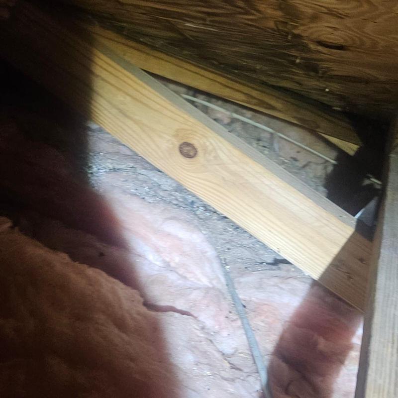 Roof decking damage under attic insulation wood framing