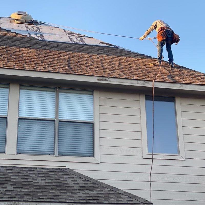 Roof shingles replacement on steep two-story roof Roof shingles replacement on steep two-story roof
