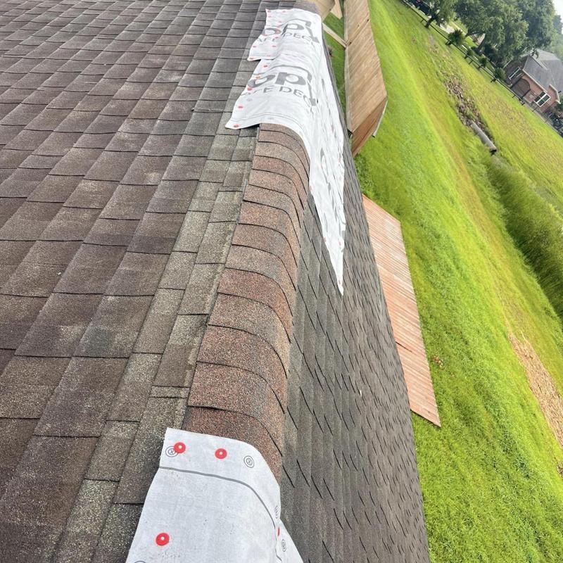 Roof ridge with temporary tarp cover in Pearland, TX