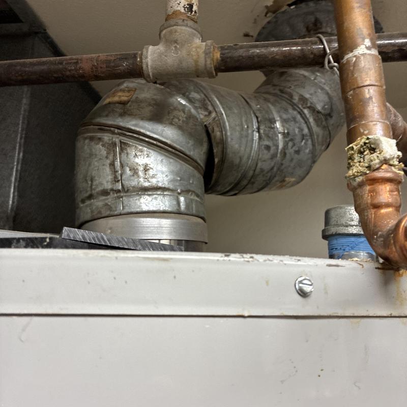 Water heater vent pipe with elbow joint and pipes