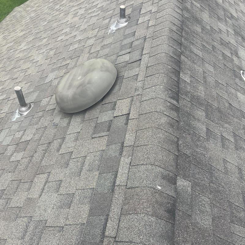 Roof shingles and vent stack with sealant repair