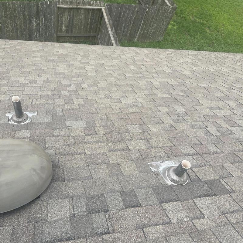 Roof vent stack seals on asphalt shingle roof
