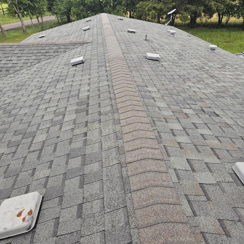 Asphalt shingle roof with visible hail damage