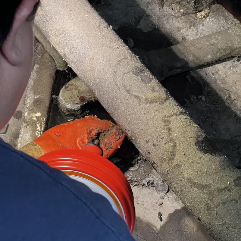 Floor sink drain unclogging with plumbing snake tool Floor sink drain unclogging with plumbing snake tool