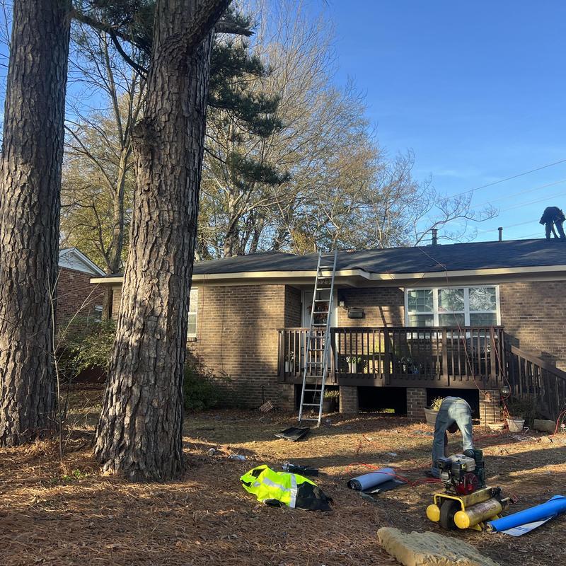 Asphalt shingle roof with new ridge vents installation