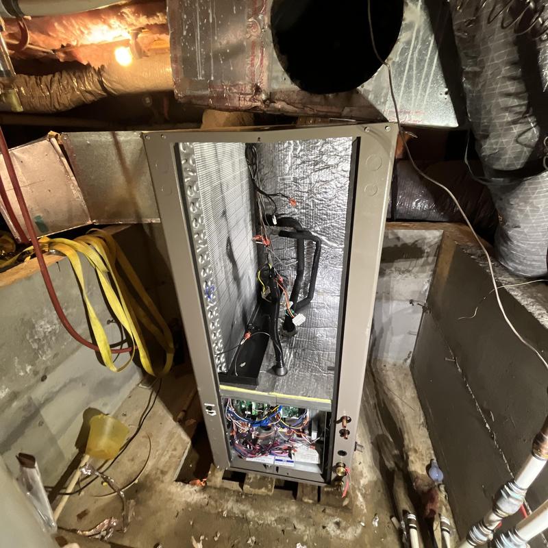 Geothermal heat pump system with exposed wiring and ductwork