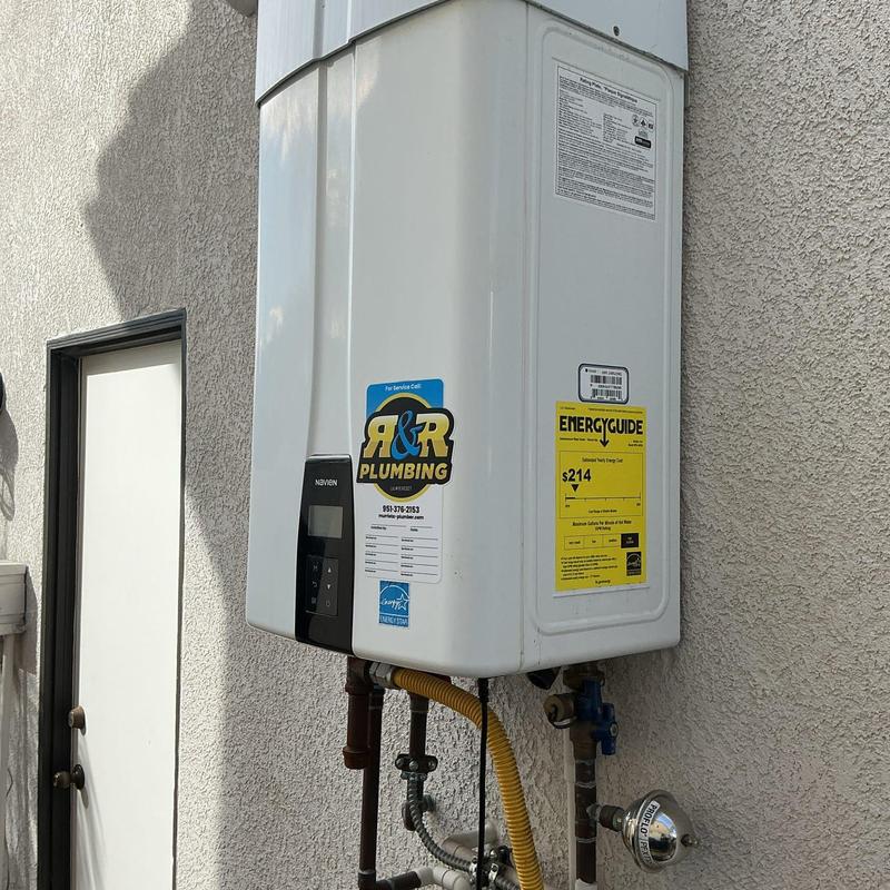 Navien tankless water heater with plumbing connections