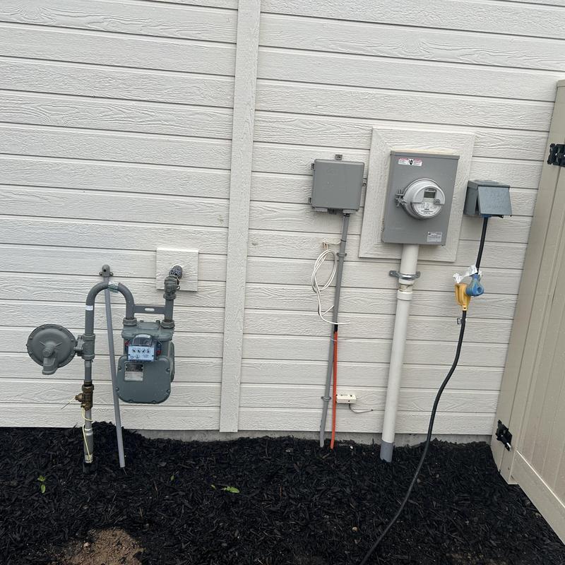 Gas meter and electrical panel installation outdoors