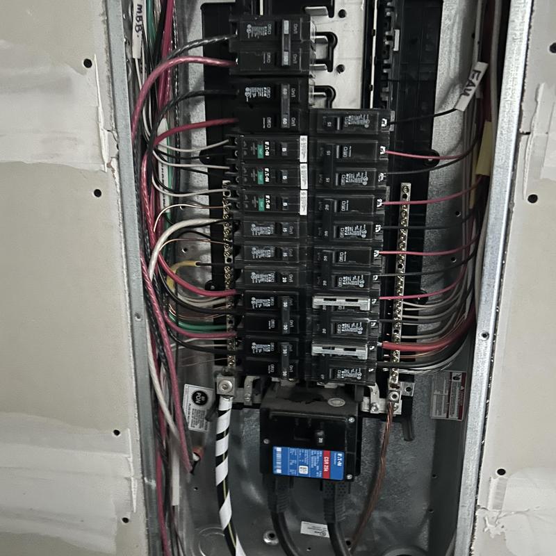 Breaker panel with wiring in home electrical system