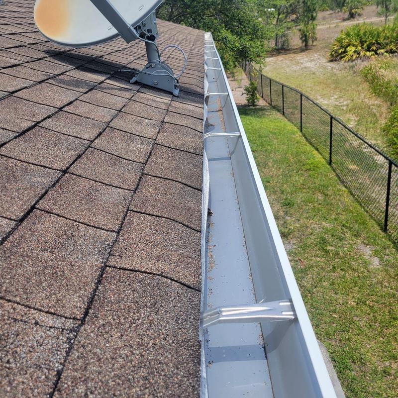 Aluminum roof gutter with minor debris buildup