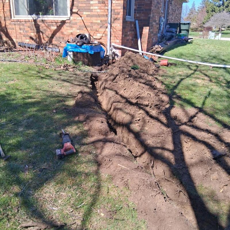 Sump line trench dug in residential backyard soil