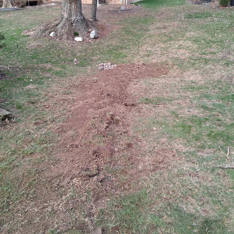 Sump line trench dug to sump basin in yard
