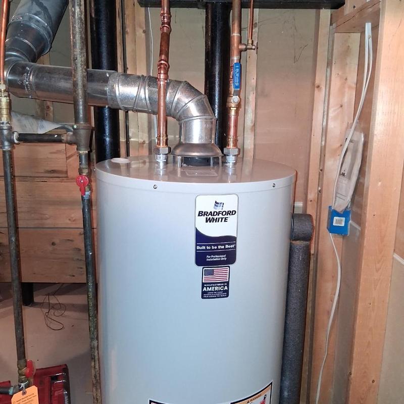 Water heater with copper piping in utility room