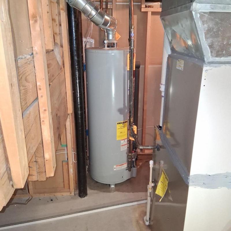 Water heater installation in basement corner