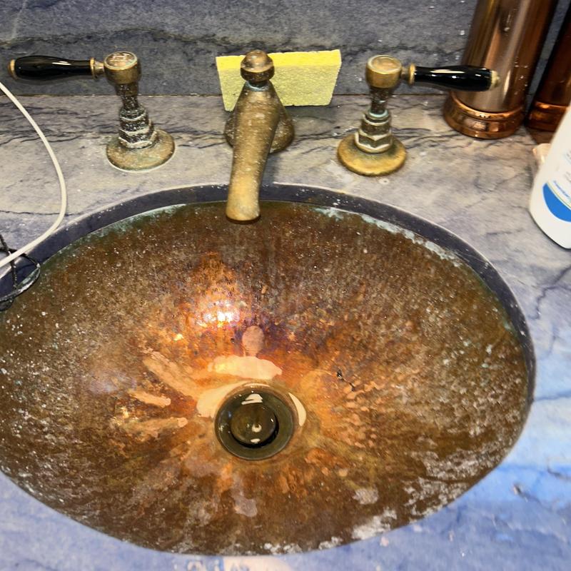 Copper bathroom sink with vintage faucet handles