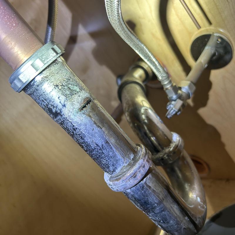 Sink drain extension pipe with corrosion and hole