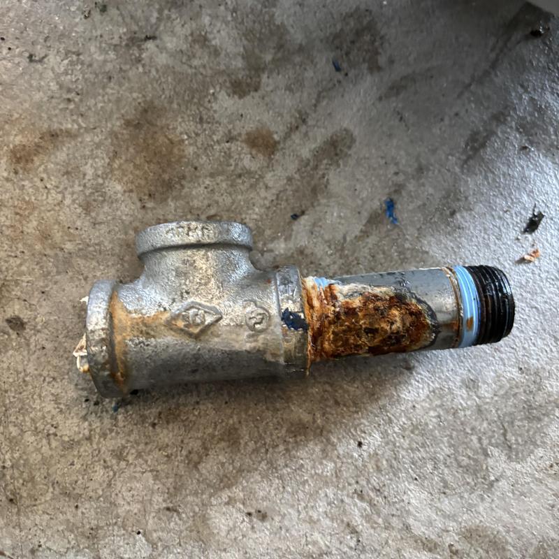 Galvanized pipe with rust and corrosion damage