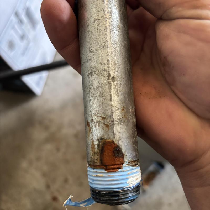 Galvanized pipe with rust and corrosion leak damage