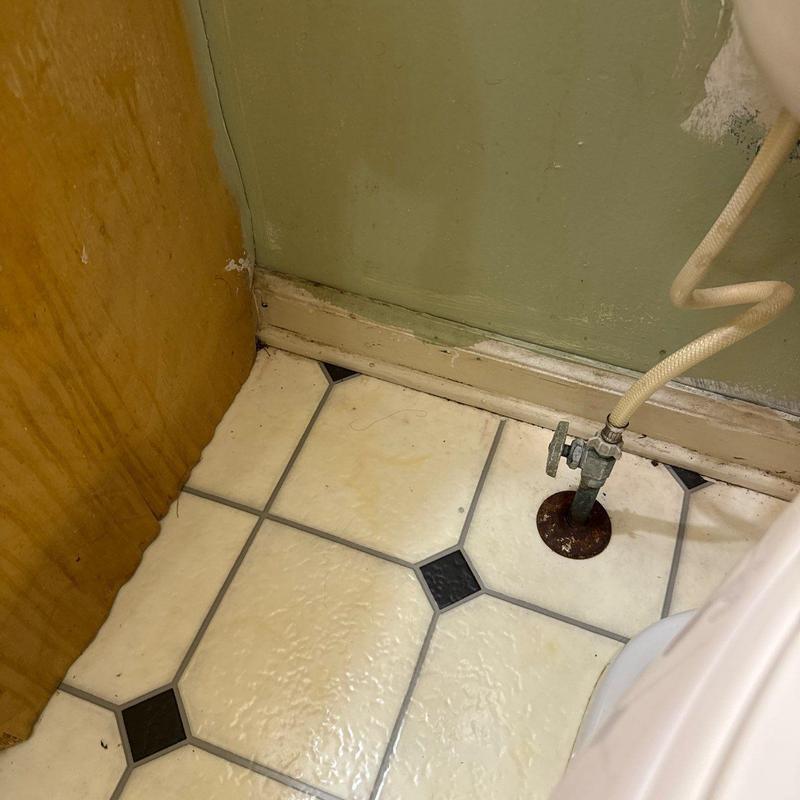 Toilet supply valve and surrounding floor corner