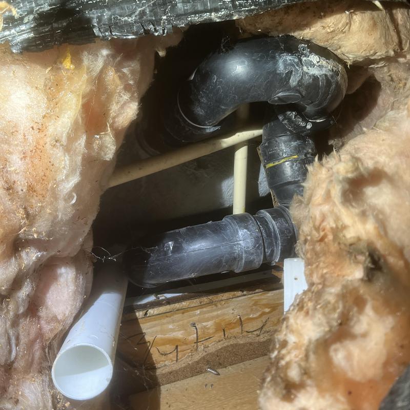 Bathtub waste and overflow pipe installation in wall cavity