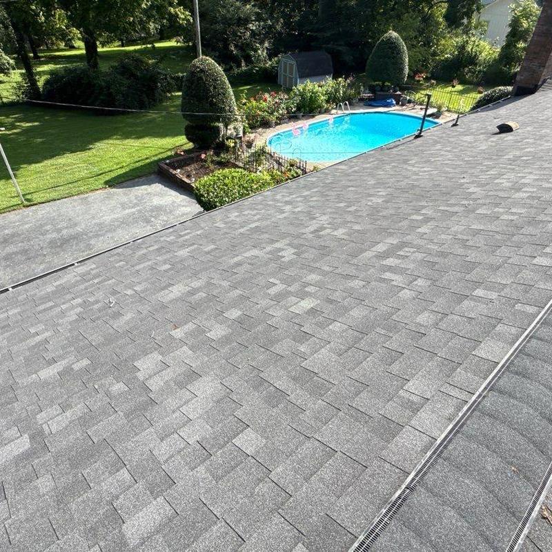 Asphalt shingle roof with hail damage inspection
