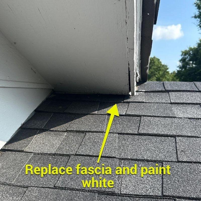 Fascia board and roof shingles with damage note