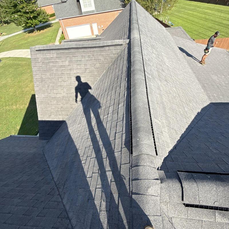 Asphalt shingle roof inspection with visible hail damage