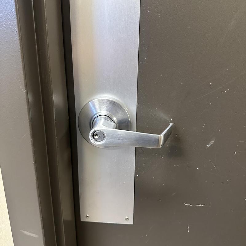 Commercial door lever lock installation on office door