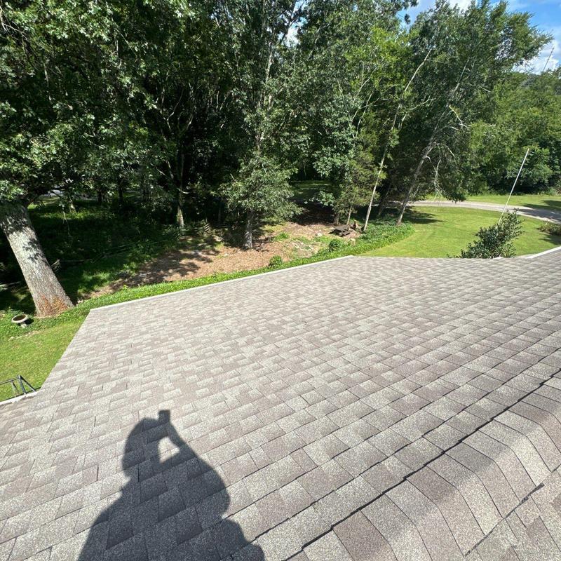 Asphalt shingle roof inspection with visible hail damage