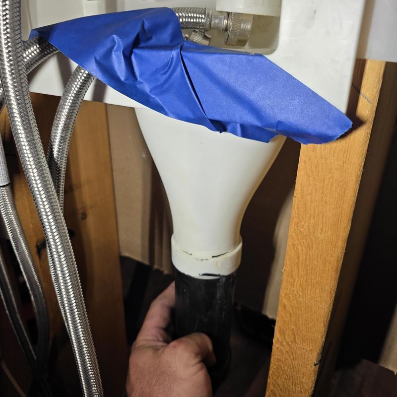 Washer drain box with taped supply lines in wall cavity