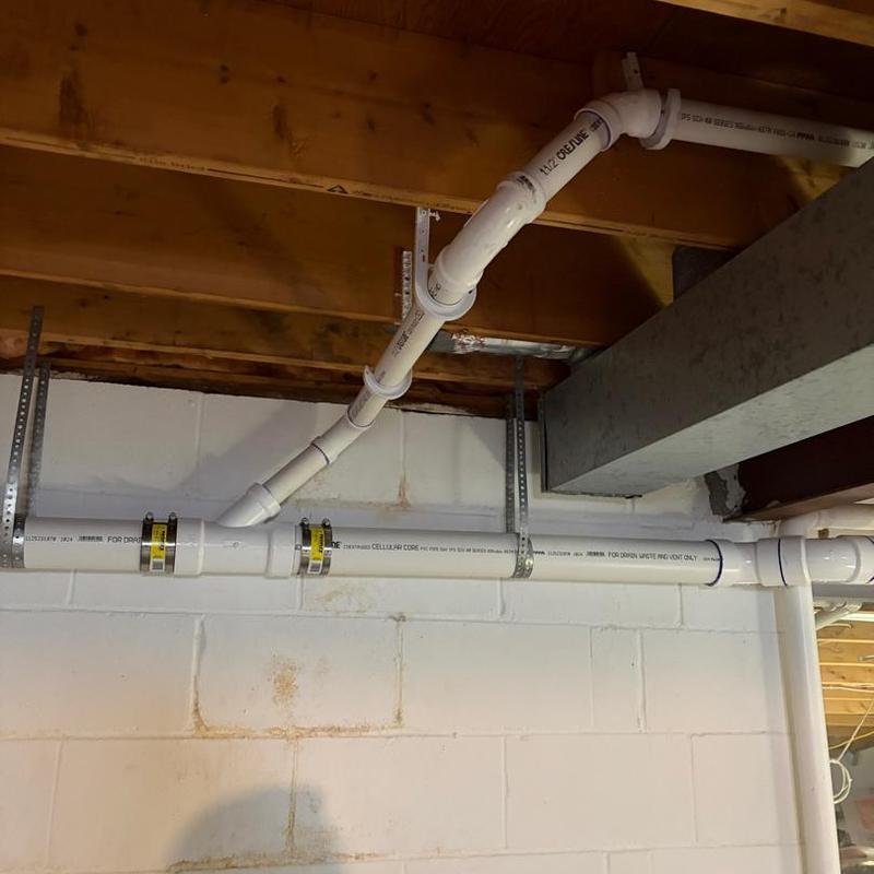 Sump pump discharge piping with shutoff valves