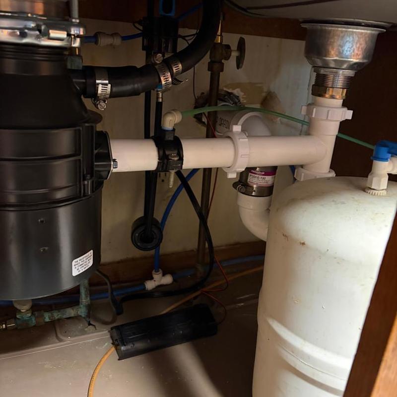 Garbage disposal installation under kitchen sink