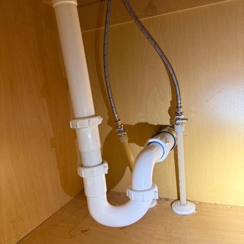 Tub drain piping with new shutoff valves under cabinet