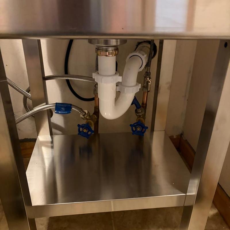 Laundry sink piping and shut-off valves under stainless sink
