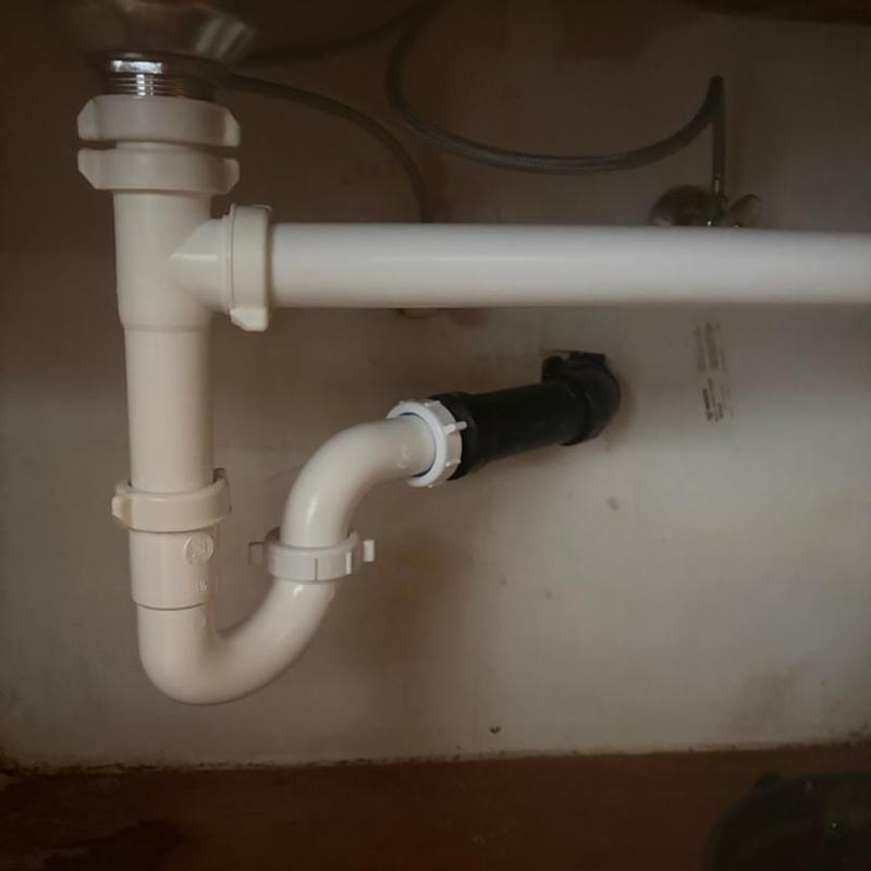 Kitchen drainpipe and plumbing under sink installation