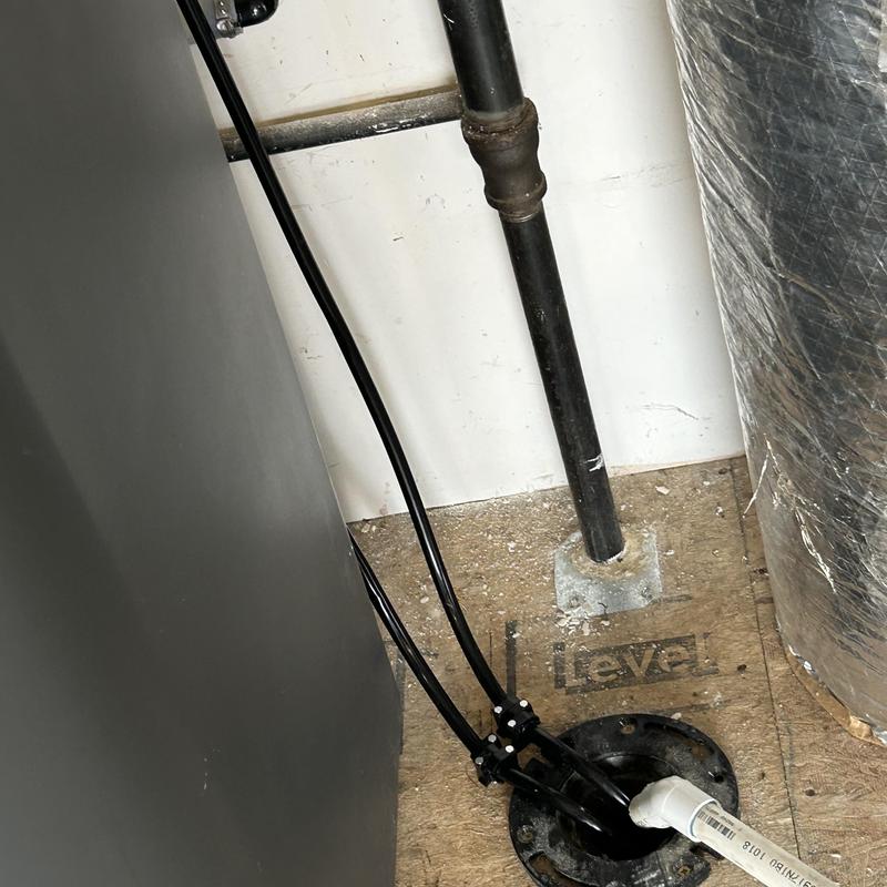 Water softener tubing and drain pipe connection detail