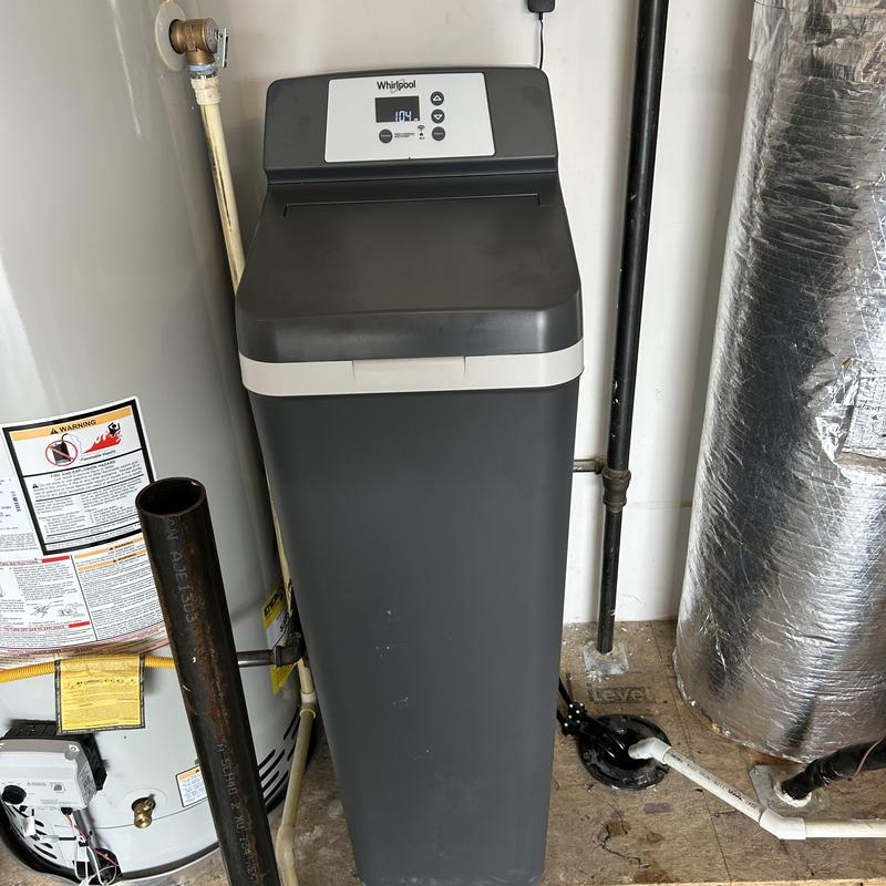 Water softener installation and programming in utility room