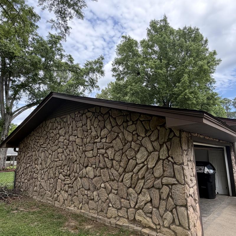 HDZ architect roof system on stone garage exterior